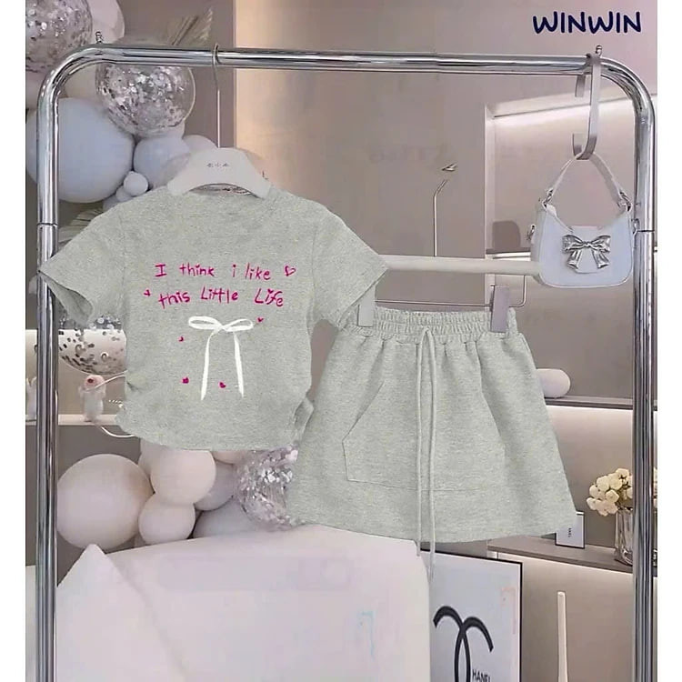 SET VÁY BÉ GÁI ÁO THUN DÂY RÚT ĐÍNH NƠ KÈM CHÂN VÁY CHỮ A TỪ 12-45KG DÀNH CHO BÉ GÁI